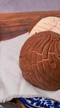 Mexican food, traditional Mexican sweet bread known as Conchas on blue talavera plate