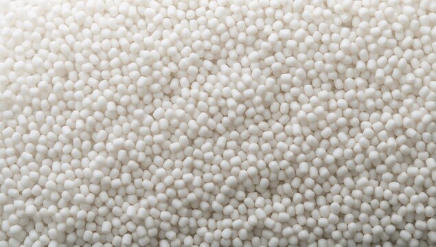 A close-up macro shot of small white tapioca pearls, ideal for culinary and food ingredient backgrounds
