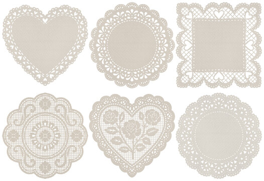 A charming collection of six beige lace doilies in various shapes and intricate patterns, isolated.