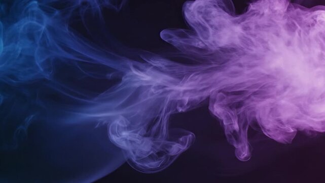 Wisps of colorful smoke swirl and dance against a dark background, creating an ethereal and abstract visual effect