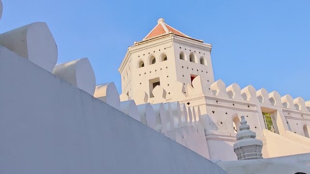 Imposing white fortress silhouetted against broad daylight sky