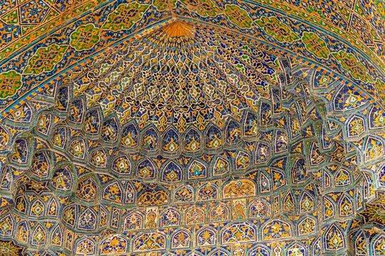 Details of the vaulted portal or iwan, an example of Islamic architecture, decorated with traditional Uzbekistan tiles. Samarkand, Uzbekistan