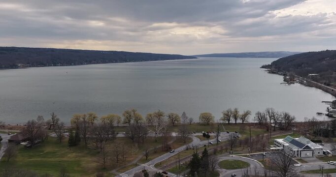 Ithaca, NY, USA - March 30, 2026  Late afternoon timelapse aerial video of the south end of Cayuga Lake and NYS Route 13 Ithaca, NY on an overcast spring day.