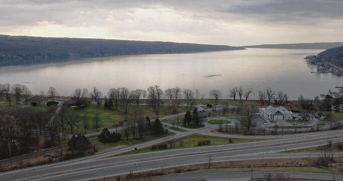 Ithaca, NY, USA - March 30, 2026  Late afternoon timelapse aerial video of the south end of Cayuga Lake and NYS Route 13 Ithaca, NY on an overcast spring day.