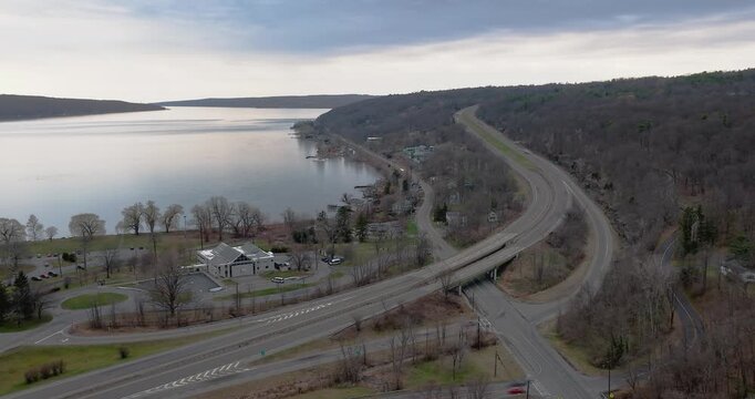 Ithaca, NY, USA - March 30, 2026  Late afternoon timelapse aerial video of the south end of Cayuga Lake and NYS Route 13 Ithaca, NY on an overcast spring day.
