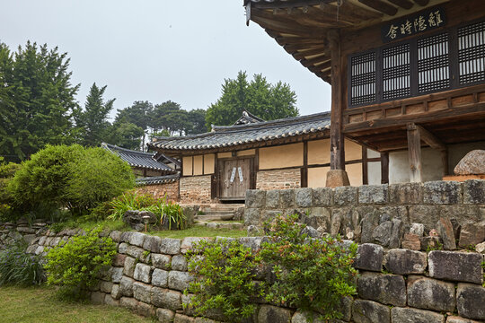 Traditional Korean earthenware jars in a hanok courtyard with historic architecture