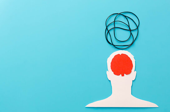 Human head cutout experiencing mental health issues and anxiety