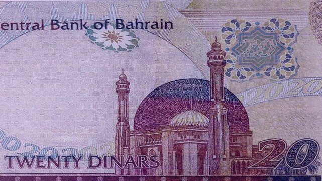 Fast-paced stop motion montage of a 20 Bahraini Dinar paper banknote. Extreme macro photography highlighting King Hamad's portrait, security features, and Middle Eastern economy concepts.

