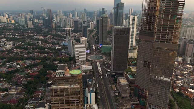 Slow motion aerial orbit view of Welcome Monument'), also known as Monumen Bundaran HI or Monumen Bunderan HI, is a monument located in Central Jakarta, Indonesia.