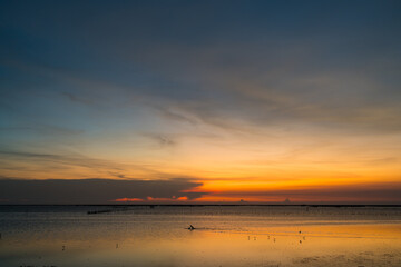 Fototapeta premium Witness the ethereal blend of sea and sky at sunset from a mesmerizing