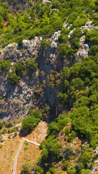 Vertical video. Fethiye, Turkey. Majestic cliffs with ancient Lycian burial chambers including the famous Tomb of Amyntas carved into rock face, aerial drone footage.. Aerial View, MasterShots, Droni