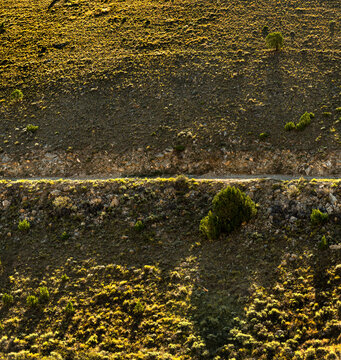 USA, Utah, Flaming Gorge National Recreation Area. Road on a steep hill at Flaming Gorge Reservoir