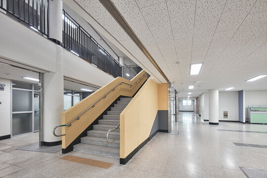 Wide corridor and staircase in clean modern school building