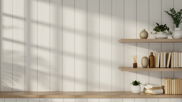Books and potted plant on floating shelf on white slats wall over wooden countertop in a modern room