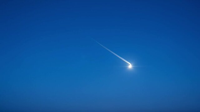 Bright comet streaking across deep blue sky celestial phenomenon