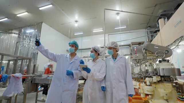 Quality Control Inspection: A team of scientists meticulously inspects the machinery, upholding the highest standards of safety, accuracy, and hygiene.