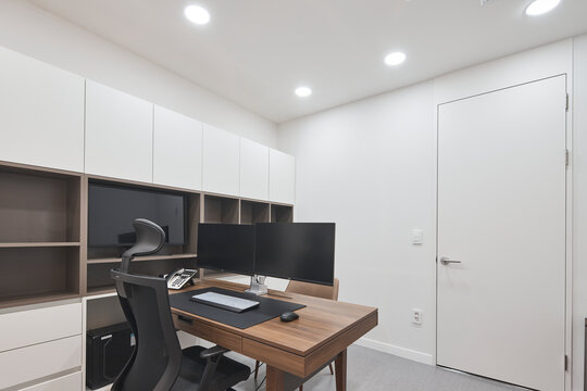 Built in desk and shelving in small bright contemporary home office