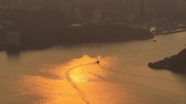 Rocky shoreline and village structures define scenic Lei Yue Mun Feb 22 2026