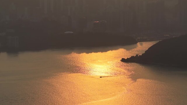Rocky shoreline and village structures define scenic Lei Yue Mun Feb 22 2026