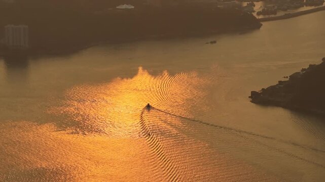 Rocky shoreline and village structures define scenic Lei Yue Mun Feb 22 2026