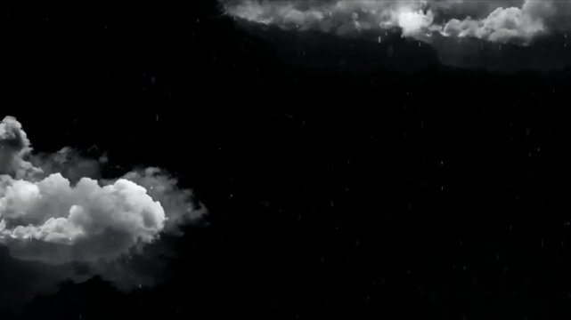 White clouds floating in dark sky with falling snowflakes video