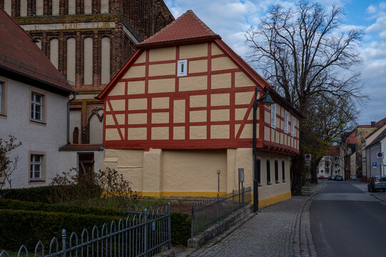 Historic half‑timbered house with church in Calau, Brandenburg