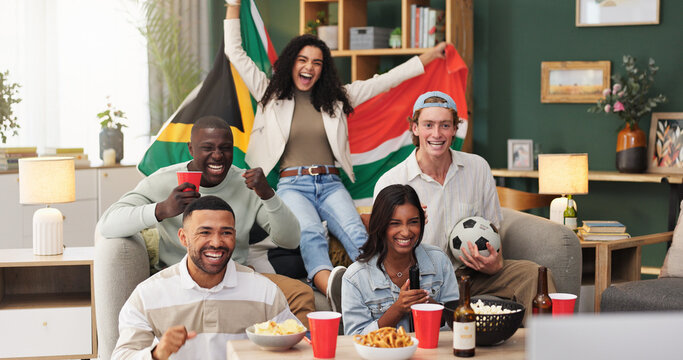 Excited, watching tv and friends with celebration in home for South African win, sports goal or snacks. Football fans, happy people and live stream with drinks for world cup match, team score or flag