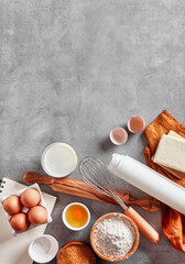 Baking ingredients with copy space on grey background