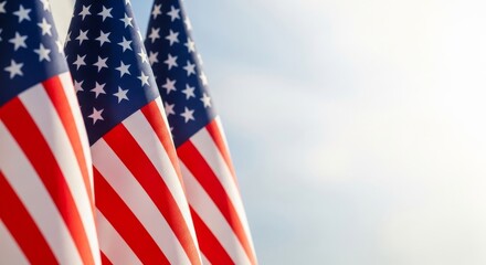 Obraz premium Patriotic display a close up of waving american flags against a bright sky