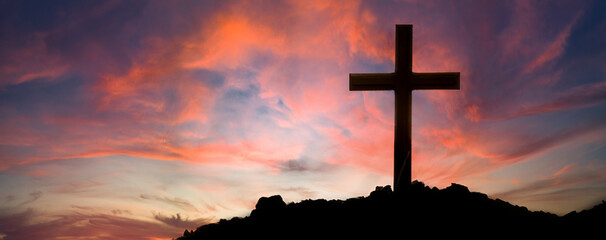 The cross standing on meadow sunset and bokeh background.Cross on a hill as the morning sun comes...