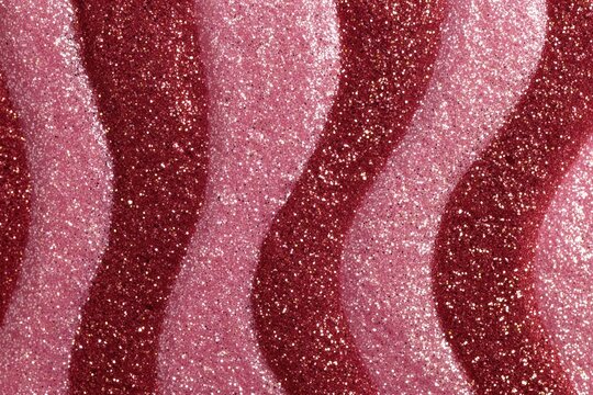 Sweet Curves: Abstract close-up of vibrant, textured gummy candies in swirling patterns, celebrating the playful essence of confectionery. 