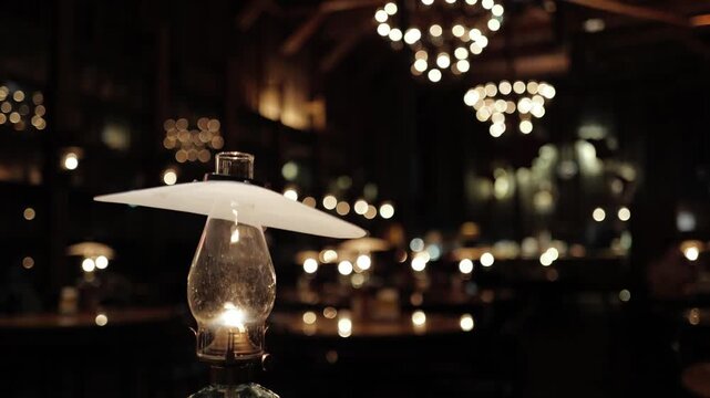 Closer look at a decorative lamp with golden light bokeh