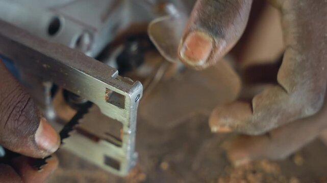 Hand positioning for precise carpentry task. Focused hand arrangement preparing for accurate cut. Carefully adjusted hand positioning and equipment readiness for meticulous woodworking accuracy