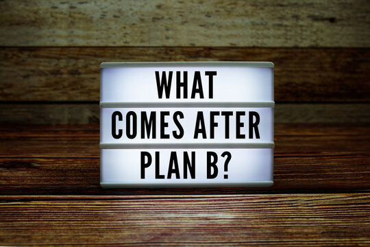 Lightbox with text "What Comes After Plan B?" on wooden background