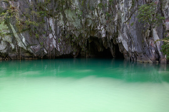 Entrance to underground river cave with emerald water in Puerto Princesa, Palawan Philippines