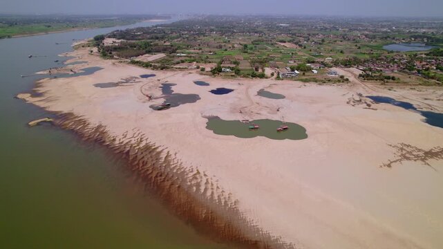 Aerial view of sadny coastline of the Mekong River.