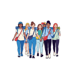 Obraz premium Diverse group of young women walking together with backpacks, concept of friendship and adventure