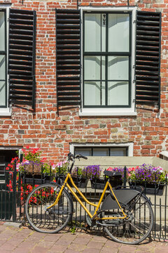 Bicycle in front of an old house in Appingedam, Netherlands