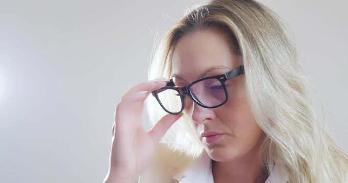 Business modern beautiful young woman Caucasian in glasses and a business suit