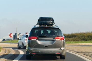Fototapeta premium Summer road trip vacation with car and roof box