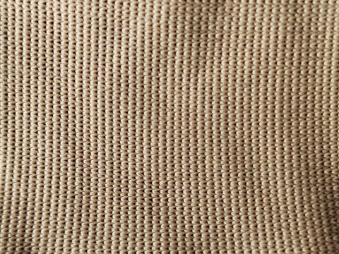 Primer plano de textura de tela de lino tejida en color beige natural con patr&oacute;n de grano uniforme