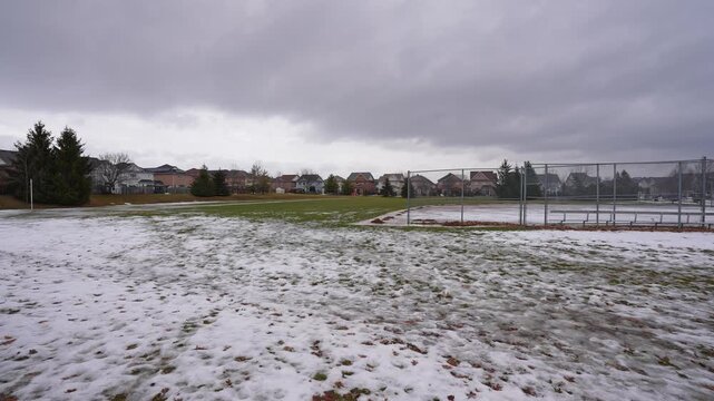 Field Covered with Patchy Ice and Snow at Kinross Park Oshawa Ontario Canada