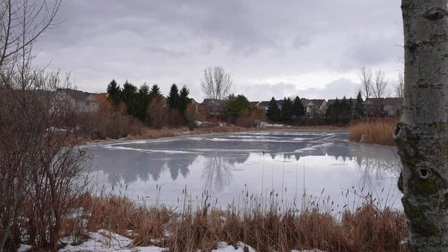 Ice Covered Lake in Urban Neighborhood at Kinross Park Oshawa Ontario Canada