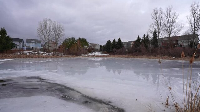 Ice Covered Lake in Urban Neighborhood at Kinross Park Oshawa Ontario Canada