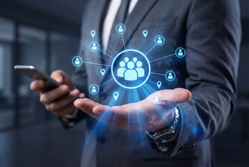 Fototapeta premium Businessman holding hand with glowing social network communication icon