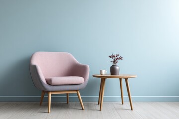 Fototapeta premium Modern armchair and side table in a room with light blue wall.