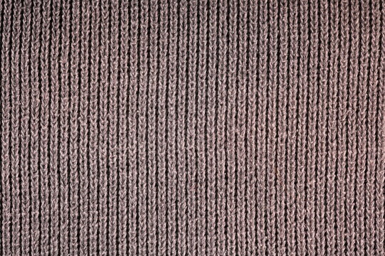 Strickmuster eines maschinell gestrickten Pullovers als Struktur und Hintergrund