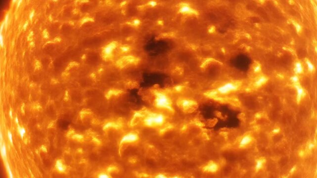 Abstract plasma surface of star background with seething golden granules and dark sunspots