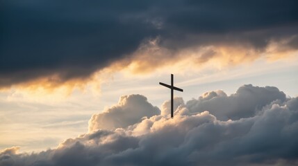 Obraz premium Christian cross silhouette rising above dramatic clouds at sunset, symbolizing hope, spirituality, and faith against a dark, stormy sky
