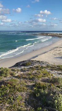 4k 60p vertical footage of dramatic coastal view to Struis Point (Struispunt) and Saxon Reef from the cliffs near Waenhuiskrans Cave, Arniston. Turquoise Overberg waters, Western Cape, South Africa.